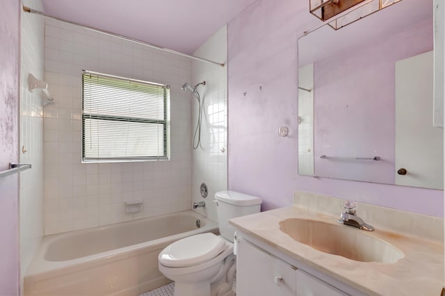 full bathroom with toilet, tiled shower / bath combo, and vanity