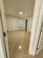 corridor featuring tile patterned flooring