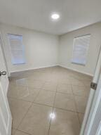 unfurnished room featuring tile patterned floors