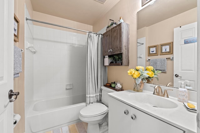 full bathroom featuring toilet, tile patterned flooring, vanity, and shower / bath combo with shower curtain