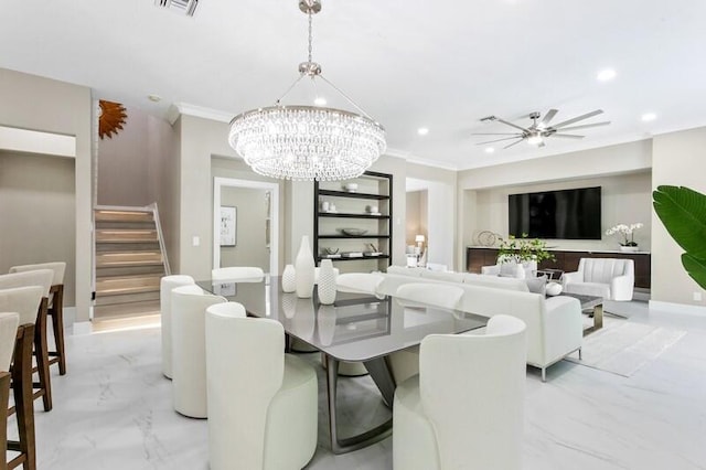 dining room featuring ceiling fan with notable chandelier and ornamental molding