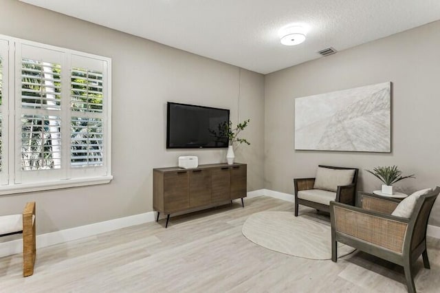 living area featuring light hardwood / wood-style floors