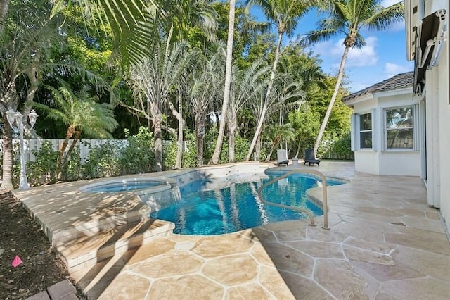 view of pool featuring a patio area and an in ground hot tub