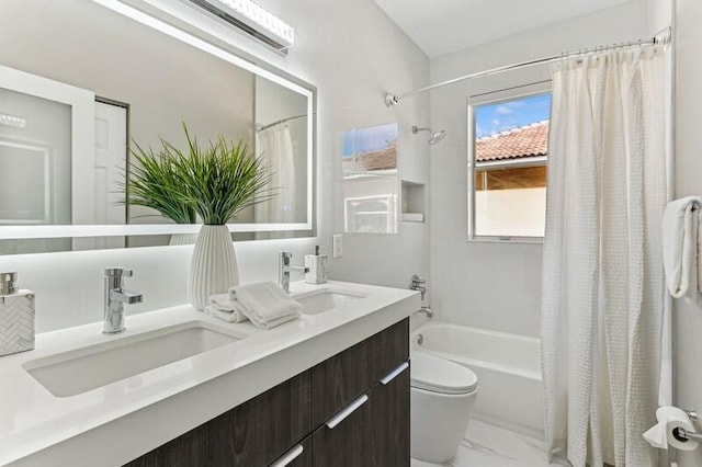 full bathroom featuring vanity, toilet, and shower / tub combo