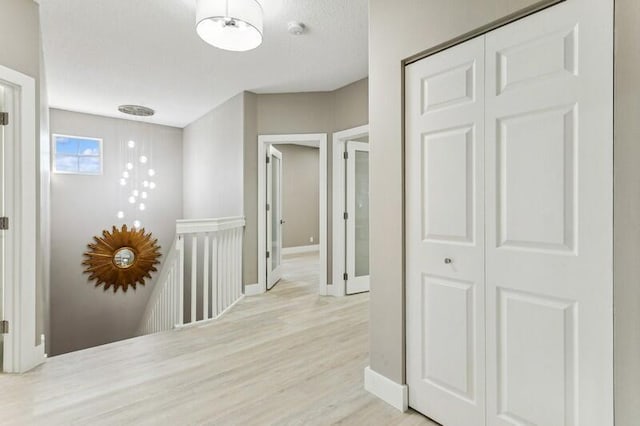 corridor featuring light hardwood / wood-style flooring