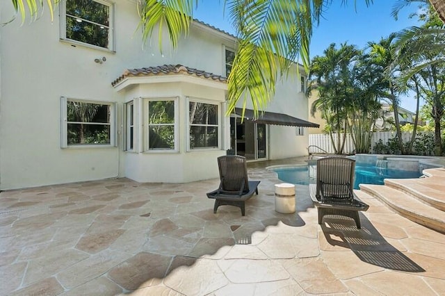 exterior space with a fenced in pool