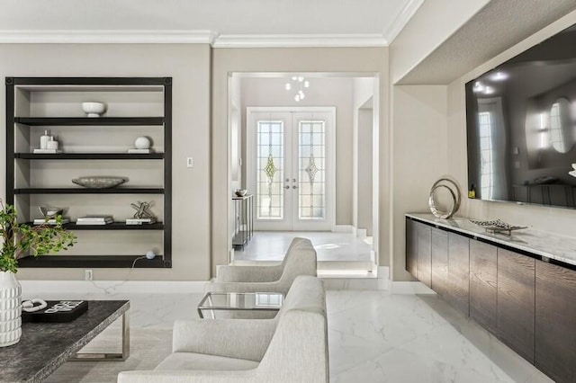 living room featuring crown molding, built in features, and french doors