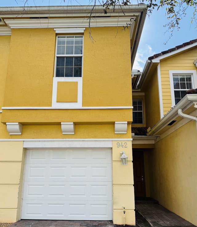 view of property exterior with a garage