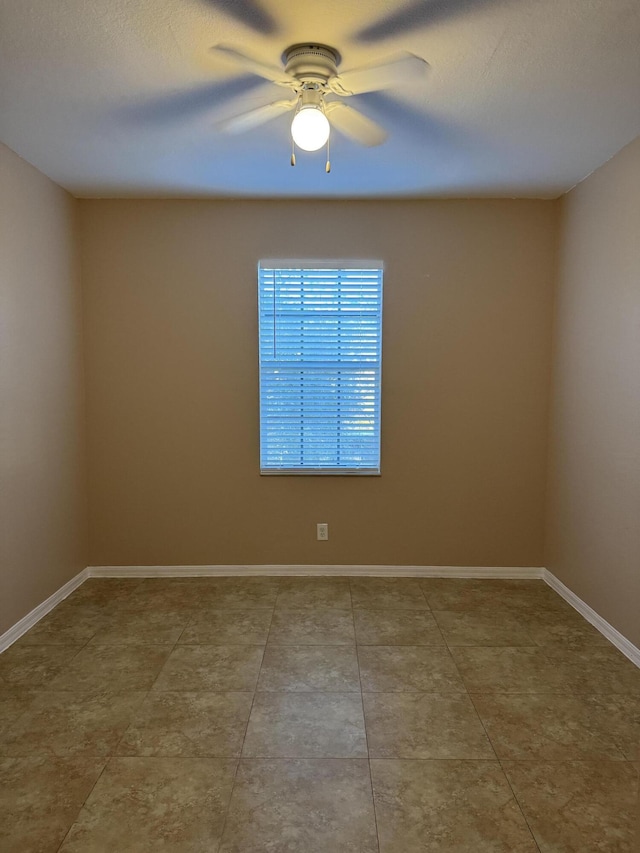 spare room with ceiling fan