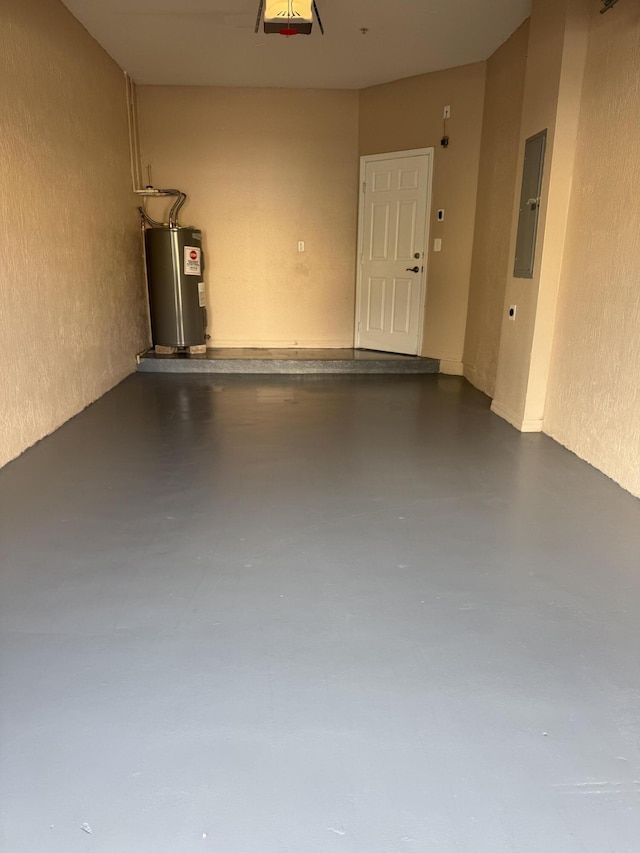 garage featuring a garage door opener and water heater