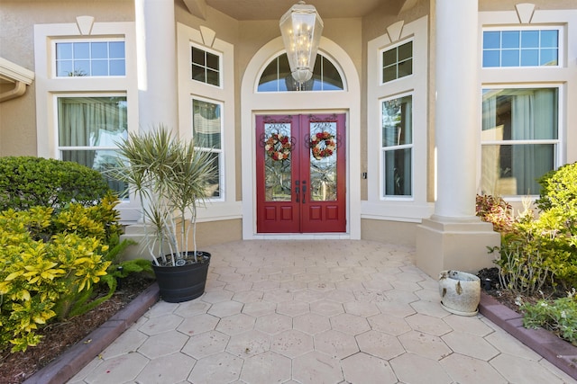 property entrance featuring french doors