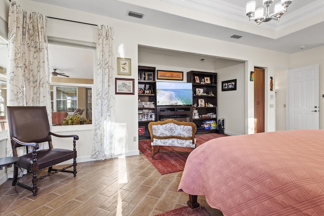 bedroom featuring ornamental molding and a notable chandelier