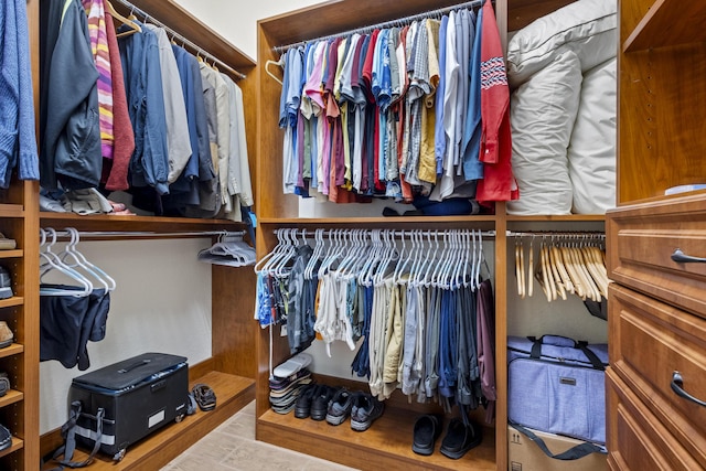 walk in closet featuring light tile patterned floors