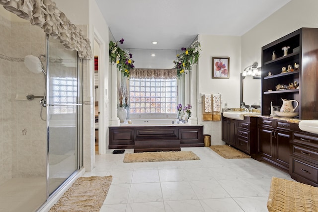 bathroom with independent shower and bath and vanity