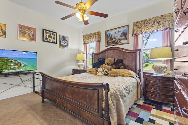 bedroom featuring hardwood / wood-style flooring and ceiling fan