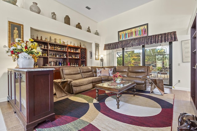 living room featuring indoor bar