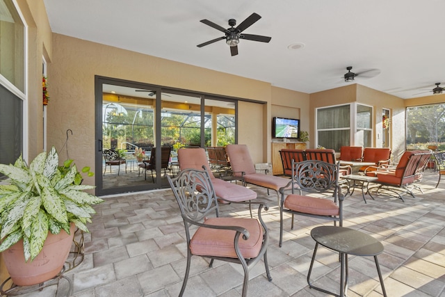 view of patio / terrace featuring ceiling fan and an outdoor hangout area