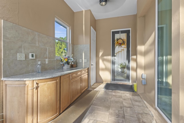 interior space featuring decorative backsplash