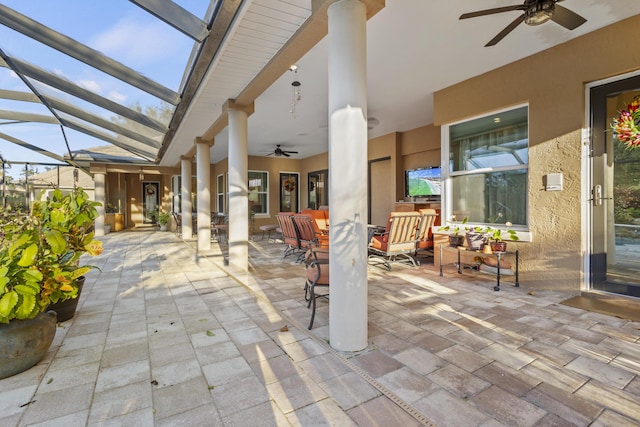 view of patio / terrace featuring a lanai and ceiling fan