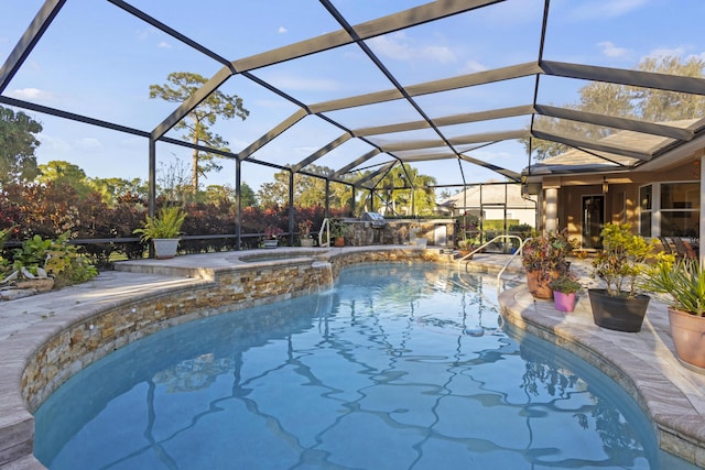 view of swimming pool with a lanai and an in ground hot tub