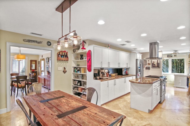 kitchen with white cabinetry, a center island, stainless steel appliances, island exhaust hood, and decorative light fixtures