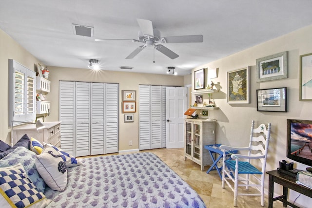 bedroom featuring two closets and ceiling fan