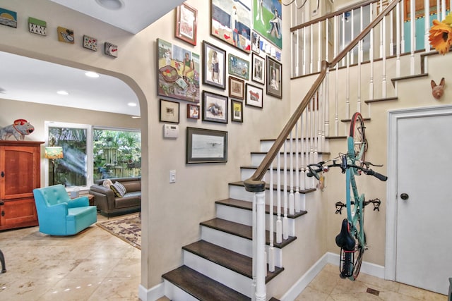 stairs featuring tile patterned floors