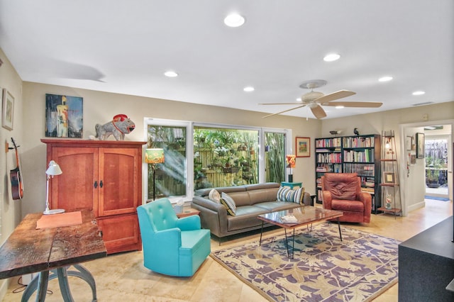 living room featuring plenty of natural light and ceiling fan