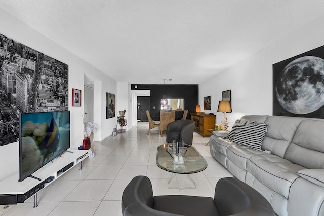 living room with a textured ceiling and tile patterned flooring