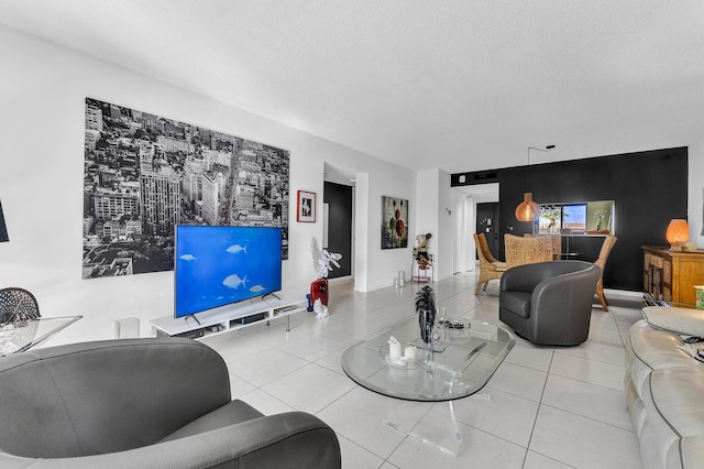 living room with tile patterned flooring and a textured ceiling