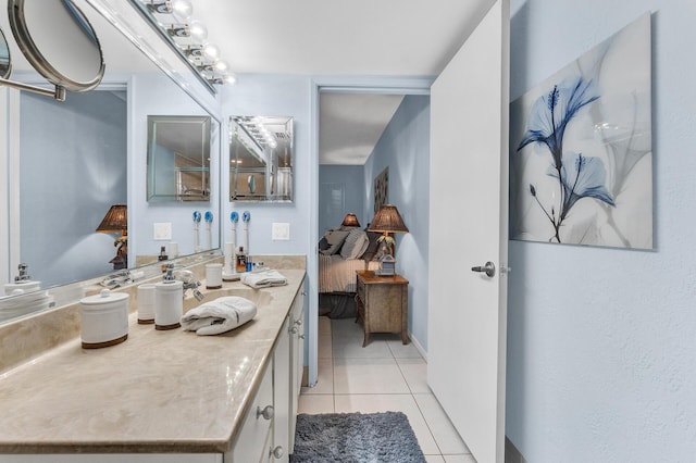 bathroom with tile patterned floors and vanity