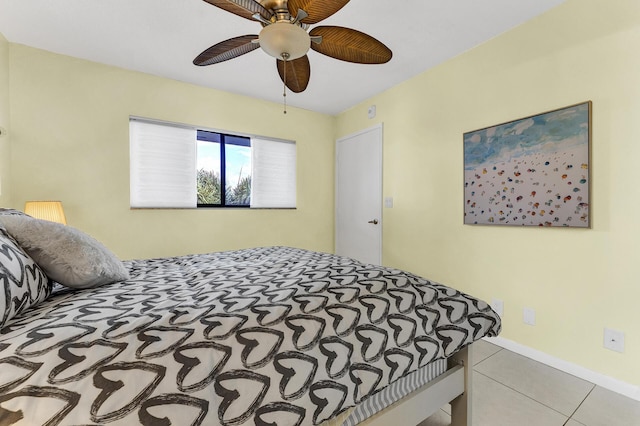 tiled bedroom with ceiling fan