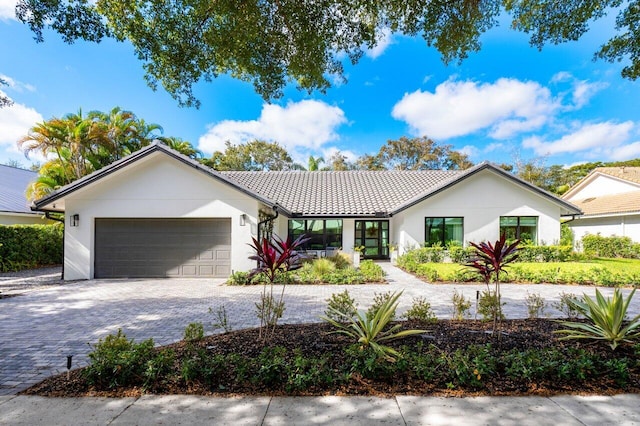 view of front of property with a garage