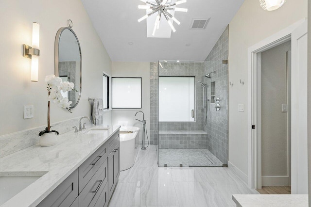 bathroom featuring plus walk in shower, vanity, and a chandelier