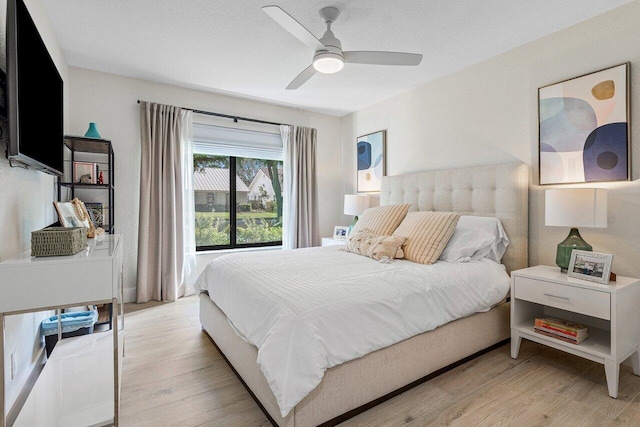 bedroom featuring ceiling fan and light hardwood / wood-style flooring