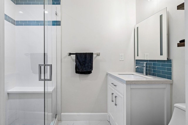 bathroom with decorative backsplash, vanity, toilet, and an enclosed shower