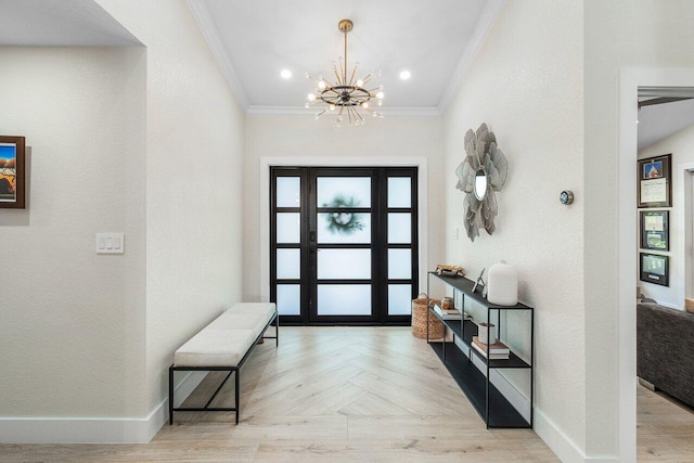 foyer with a chandelier, light parquet floors, and ornamental molding