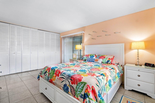 tiled bedroom with a closet