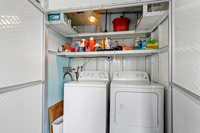 washroom with separate washer and dryer