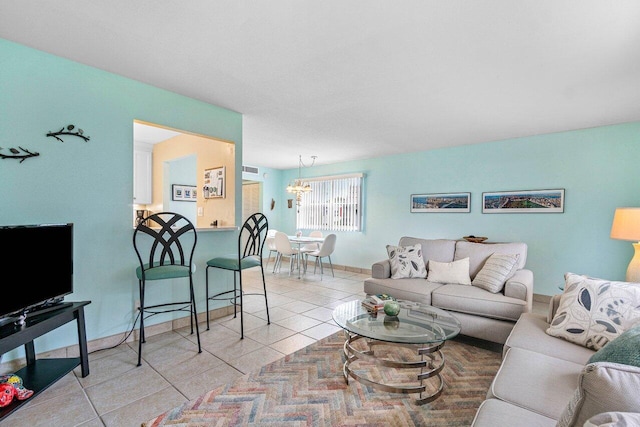 living room with an inviting chandelier and light tile patterned flooring