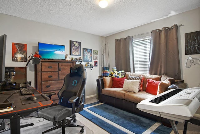 carpeted home office featuring a textured ceiling