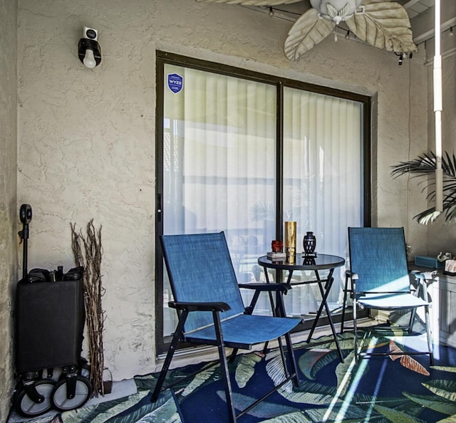 view of patio featuring ceiling fan