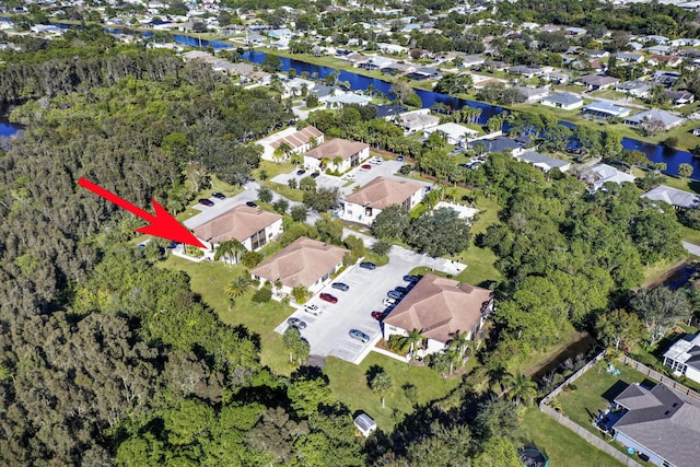 aerial view with a residential view and a water view