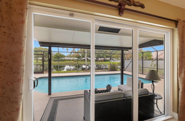 view of swimming pool with a water view