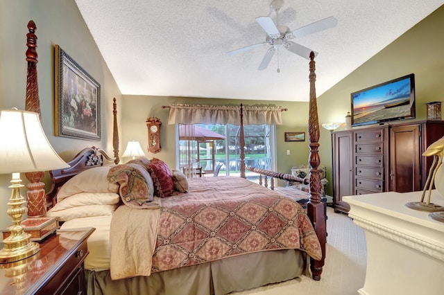 bedroom featuring ceiling fan, a textured ceiling, carpet floors, and lofted ceiling