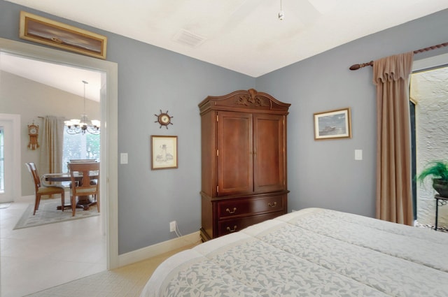 bedroom with vaulted ceiling and a chandelier