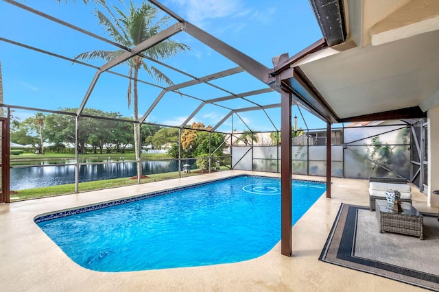 view of swimming pool with a patio area, glass enclosure, and a water view