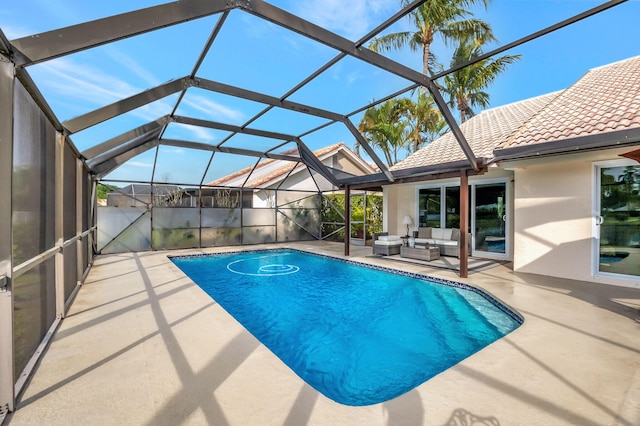 view of swimming pool with a lanai, an outdoor living space, and a patio