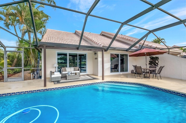 exterior space featuring a lanai, outdoor lounge area, and a patio