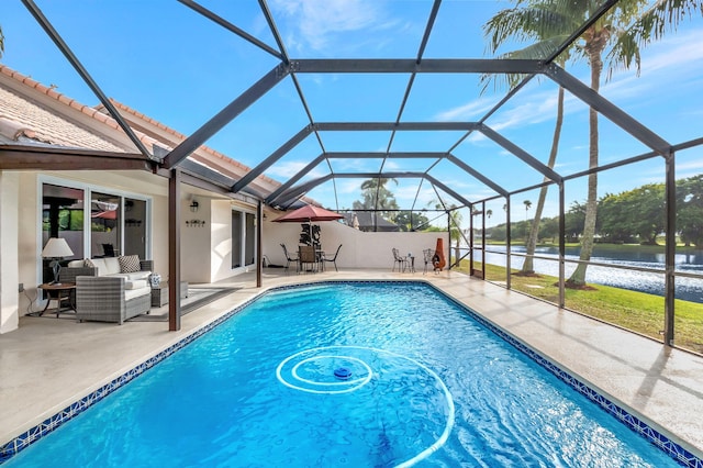 view of swimming pool featuring a lanai, outdoor lounge area, a water view, and a patio